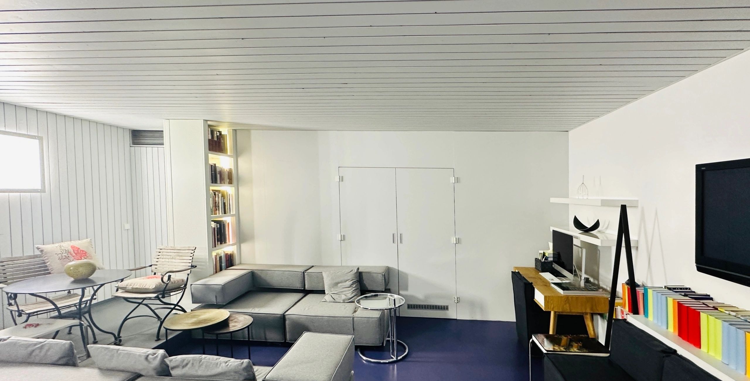 Home office with sofa landscape and desk